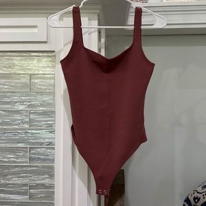 Beautiful Express bodysuit. Never worn.